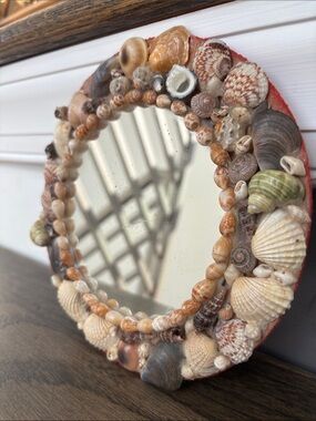 Vintage shell covered mirror, mix of colors/shapes, velvet back, 7.5”